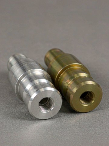 CNC machining of an aluminum robot arm component with chips cleared under flood coolant