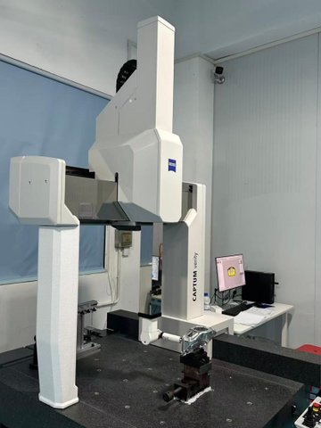 Zeiss CAPTUM bridge CMM with a machined housing staged on the granite table