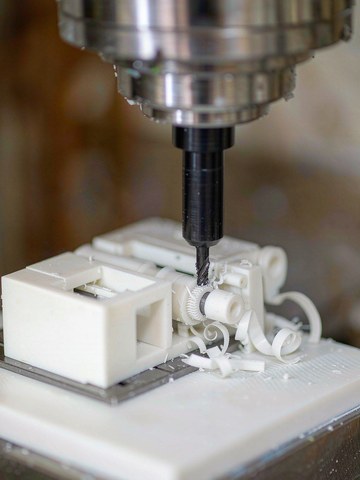 Milling a precision aluminum part on a vertical machining center with coolant flow