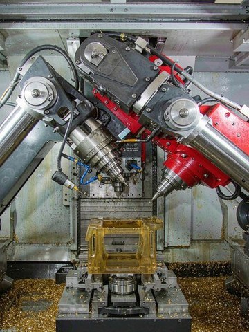 Five-axis machining of an amber ULTEM 1000 aerospace housing with compressed air cooling instead of liquid coolant.