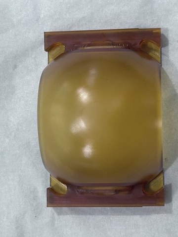 Amber PEI aerospace wastewater housing. CNC machining eliminated layer-bond leakage risk and improved dimensional accuracy.