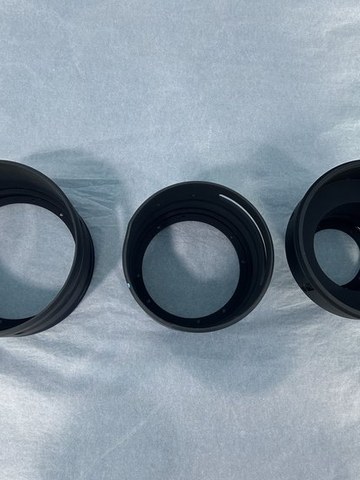 Machined aluminum optical lens barrel with fine-pitch threads and mounting flange. Coaxiality is held within 0.002 mm.